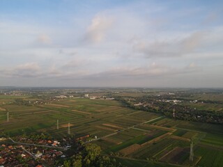 Fototapeta na wymiar Aerial view of rice field with road in Yogyakarta, Indonesia