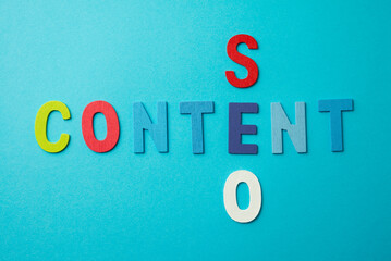 Content and SEO marketing is king of advertising and communication business on media, social media, blog,clip vdo, website online. Content and SEO colorful alphabets on blue background.