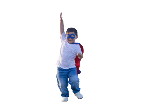 Portrait of adorable kid boy having fun outdoor. Little child play superhero