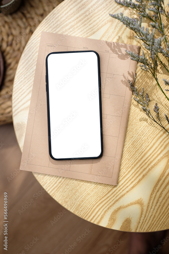 Poster mockup blank screen mobile on round table with sunlight