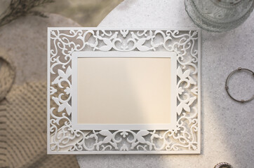 mockup vintage blank photo frame on stone table with sunlight