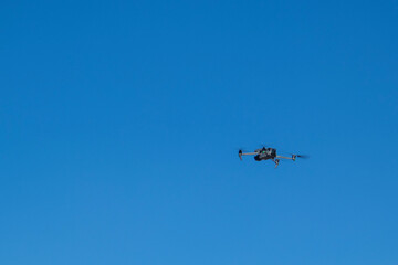 the quadcopter is in the air. quadcopter in the blue sky
