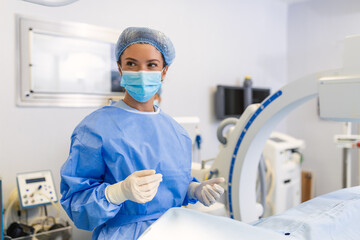 Female surgeon with surgical mask at operating room using 3d image guided surgery machine