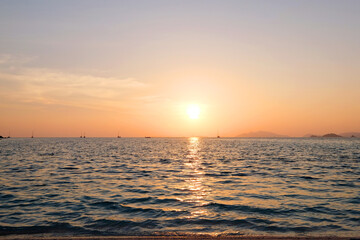 Sunset in Thailand. Sea view. Beautiful golden glow.