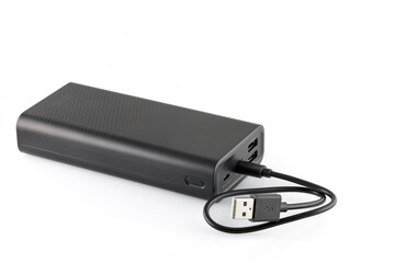 Additional self-contained external battery for charging mobile and other device. Power bank isolated on white background. Stylish charger (rechargeable battery). Full depth of field.