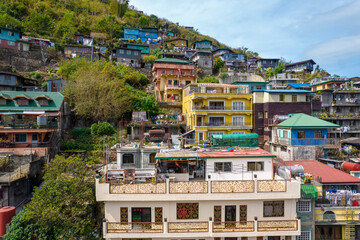 Fototapeta na wymiar Baguio City, Philippines - Colorful houses at the Valley of Colors along the Halsema Highway, between the border of La Trinidad and Baguio.
