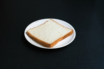 Sliced bread in a white plate, Homemade bread for breakfast in the morning.