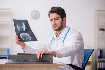 Young male doctor radiologist working in the clinic