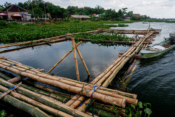 Fototapeta na wymiar spots for fishing are made of bamboo that has been arranged, local residents usually fish here