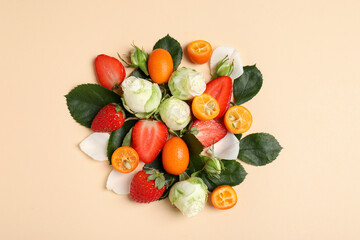 Flowers and delicious fruits on beige background