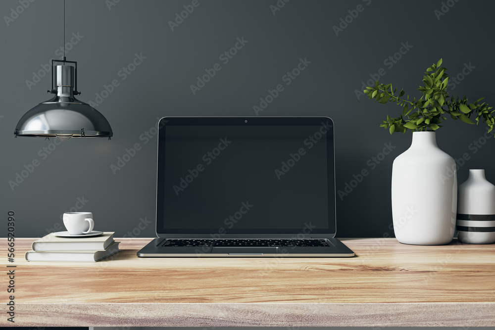 Aufkleber Close up of designer office interior with various objects, coffee cup and empty mock up place on laptop computer monitor. Wooden desktop. 3D Rendering.