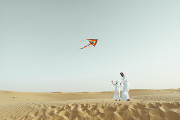 father and son spending time in the desert