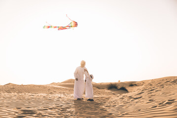 father and son spending time in the desert