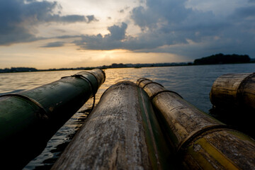 close up of floating bamboo with sunset background