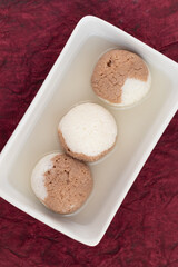 Indian Mithai Chocolate Rasgulla Also Called Choco Gulla, Rasagola, Rosgola, Roshogolla, Rossogolla, Rasbhari Or Rasbari Is Ball Shaped Dumpling Made Of Chhena, Sugar Syrup, Chena, Panir ,Paneer