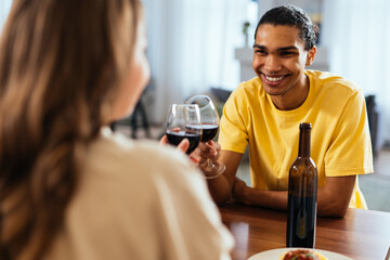 Modern multiethnic unstereotyped couple lifestyle moments at home.