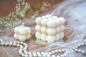 Fototapeta na wymiar Soy handmade candles. Two natural white bubble candles. Decor 