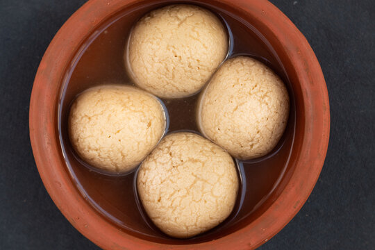 Indian Mithai Gurer Rosogolla Also Called Rasgulla, Rasagola, Rosgola, Roshogolla, Rossogolla, Rasbhari Or Rasbari Is Ball Shaped Dumpling Made Of Chhena, Sugar Syrup, Gud, Chena, Panir, Paneer, Gur