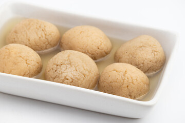 Indian Mithai Gurer Rosogolla Also Called Rasgulla, Rasagola, Rosgola, Roshogolla, Rossogolla, Rasbhari Or Rasbari Is Ball Shaped Dumpling Made Of Chhena, Sugar Syrup, Gud, Chena, Panir, Paneer, Gur
