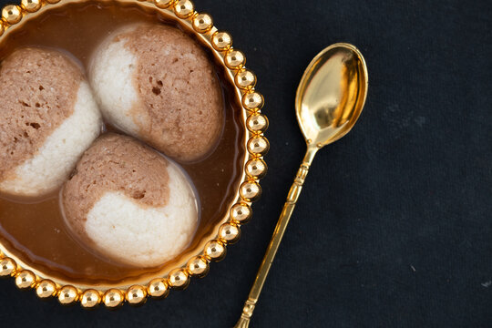Indian Mithai Chocolate Rasgulla Also Called Choco Gulla, Rasagola, Rosgola, Roshogolla, Rossogolla, Rasbhari Or Rasbari Is Ball Shaped Dumpling Made Of Chhena, Sugar Syrup, Chena, Panir ,Paneer
