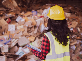 workers in recycling factory,Worker checking paper waste, engineer or worker with environment...