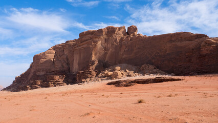 Rugged sandstone mountains and red sandy landscape of Arabian Wadi Rum desert in Jordan, Middle East