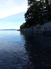 View on the lungomare, from a beach in Lovran, Istra, Croatia; the Franz Joseph I Promenade, known locally as the Lungomare, is a landmark of Opatija, Croatia