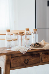Fototapeta na wymiar Zero waste concept. Textile eco-bags and empty glass jars on a wooden table. 