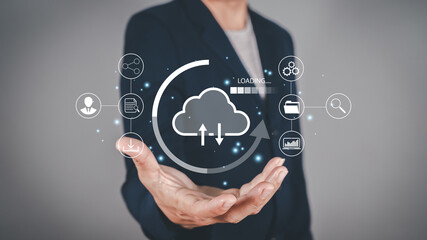 Businessman holding virtual glowing cloud computing to download and loading data information and upload on system network application. Technology data transformation concept.