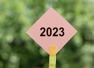 There are bright pink sticker with the text 2023. Copy space