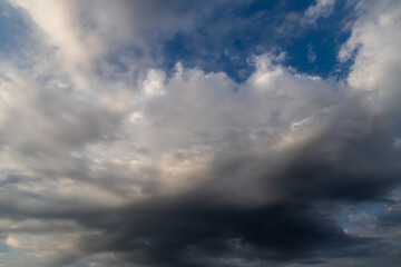 Unusual dark gray layered stratus clouds, skyscape.