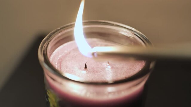 Lighting a candle with two wicks two fires one candle