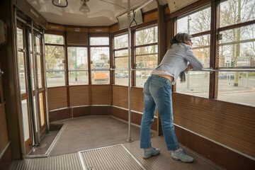 Woman Travel in a Tram in Milan, Lombardy in Italy.