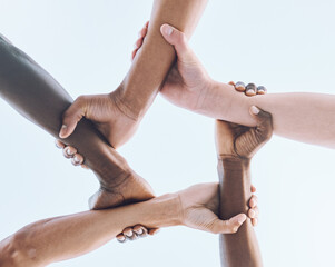 Below, hands and team, sports and collaboration, partnership and huddle against sky background....