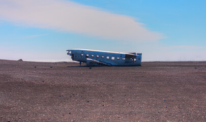 Scenic view of DC-3 airplane wreckage at black beach, S&oacute;lheimasandur, Iceland
