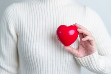 woman hand holding red heart shape. love, donor, world heart day, world health day and Insurance...