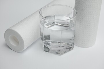 filter cartridges for water on a white background. Installation of reverse osmosis water purification system.
