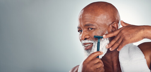 Black man, beard and shaving face in skincare for grooming, self care or facial treatment on...