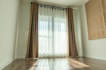 Obraz premium Curtain window interior decoration in living room on sunny day with sunlight