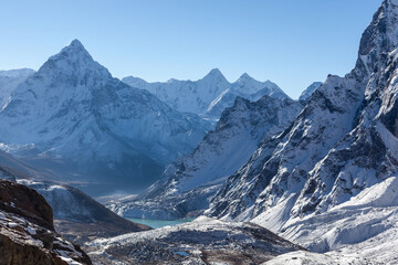 High mountain peaks in snow. Landscape in Nepal on the way to Cho La pass with moutn Ama Dablam.