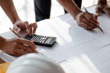 Architects and engineers are working together to edit the draft house plan that was designed after it was presented to the client and partially revised the design. Interior design and decoration ideas