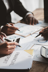 The sales department is having a monthly summary meeting to bring it to the department manager, they are verifying the correctness of the documents that are prepared before bringing in to the manager