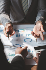 The sales department is having a monthly summary meeting to bring it to the department manager, they are verifying the correctness of the documents that are prepared before bringing in to the manager