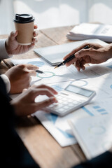 The sales department is having a monthly summary meeting to bring it to the department manager, they are verifying the correctness of the documents that are prepared before bringing in to the manager