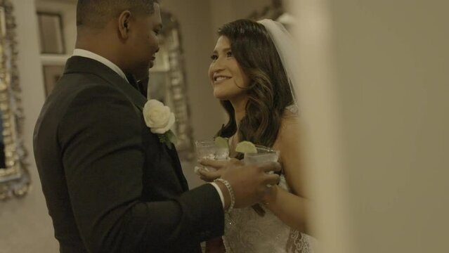 Happy bride and groom talking and enjoying drinks on their wedding day. Smiles. Shot in 4K 60 FPS. To purchase entire event raw at wholesale price email willneatheryyahoo.com.