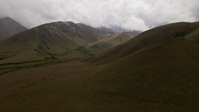 Aerial - gloomy overcast weather in the mountains of Canterbury, New Zealand