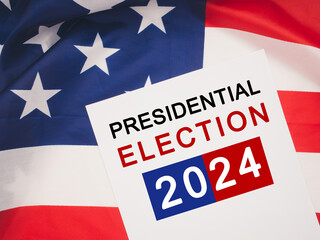 Fototapeta na wymiar Presidential Election 2024 text on white paper over the American Flag
