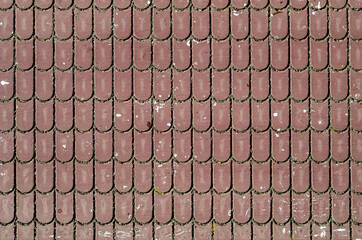 dirty old ceramic tiles on the roof of the house