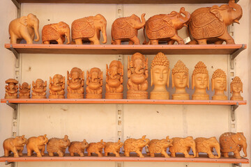 Wooden souvenirs on display in a gift shop in India.