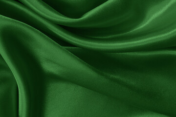 Dark green fabric cloth texture for background and design art work, beautiful crumpled pattern of...